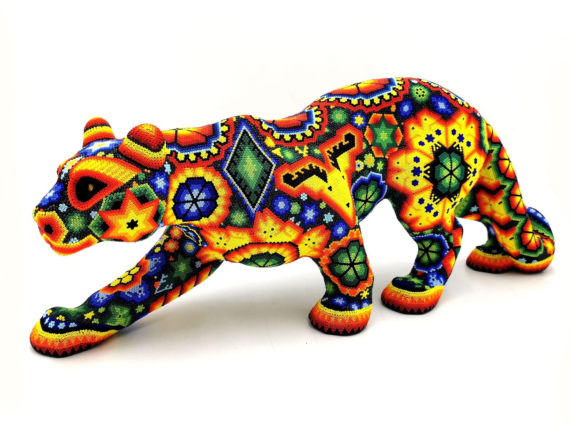 Huichol inspired Jaguar figure in resin decorated with glass beads by Espacio Kanuwa